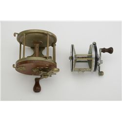 Two old fishing reels including a Pflueger  CAPITOL  No. 1989 reel in well-used condition  and a lar