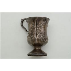 Antique ornate silver drinking cup approx.  5-1/2” in height with raised floral design  and fancy ha