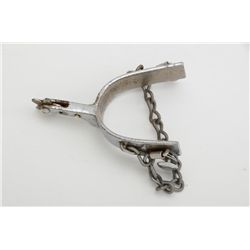 One Kelly-marked nickeled spur with small  star rowel and attached chain.  Est.:   $50-$75.
