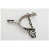 Image 1 : One Kelly-marked nickeled spur with small  star rowel and attached chain.  Est.:   $50-$75.