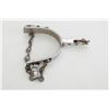 Image 2 : One Kelly-marked nickeled spur with small  star rowel and attached chain.  Est.:   $50-$75.