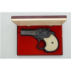 High Standard Model DM-101 O/U derringer, .22  Magnum cal., 3-1/2” barrels, blue finish,  faux ivory