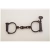 Image 1 : Hiatt Darby handcuffs, dark patina, with key  marked “13”, in working order at time of  description,