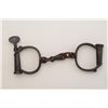 Image 2 : Hiatt Darby handcuffs, dark patina, with key  marked “13”, in working order at time of  description,