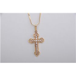 One 14k yellow gold beautifully crafted cross  set with 22 full cut G, VS, diamonds  weighing approx