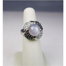 Mesmerizing 14 karat white gold ladies custom  made ring set with a fine blue-gray star  sapphire we