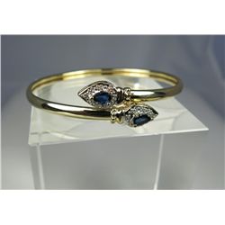 Sleek 14 karat yellow gold ladies designer  inspired bangle set with two matching pear  shape sapphi