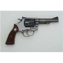 Smith & Wesson Model 34-1 DA revolver, .22LR  cal., 4” barrel, blue finish, checkered wood  medallio