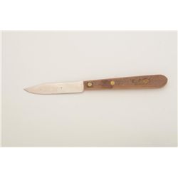 Remington-marked knife with wood grip approx.  7” overall with a 3” blade in very good  condition.  