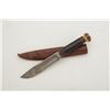 Image 3 : Knife and leather sheath; knife is approx.  10-1/2” overall with a 6” blade and stacked  leather gri