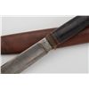 Image 4 : Knife and leather sheath; knife is approx.  10-1/2” overall with a 6” blade and stacked  leather gri