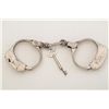 Image 1 : Bean Patrolman handcuffs, nickel plated with  key, working at time of description, in  overall very 