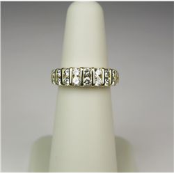 Classis 14 karat yellow gold ladies ring  channel set with 18 round brilliant cut  diamonds weighing