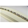 Image 2 : Elegant 10 karat two-tone gold ladies  bracelet channel set with 60 round diamonds  weighing approx.