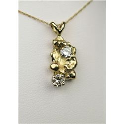 Terrific 14 karat yellow gold ladies custom  made nugget necklace set with two round  diamonds weigh