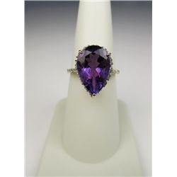 Colorful 10 karat yellow gold ladies ring set  with a large pear shape Amethyst weighing  approx. 7.