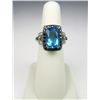 Image 1 : Exquisite 10 karat white gold ladies ring set  with a large Swiss blue Topaz weighing  approx. 7.00 