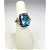 Image 2 : Exquisite 10 karat white gold ladies ring set  with a large Swiss blue Topaz weighing  approx. 7.00 