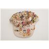 Image 1 : Cap with dozens of different collector pins,  mostly law enforcement, from the 1984 Summer  Olympic 