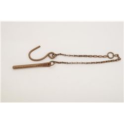 Brass U.S. pistol storage device consisting  of a hook, chain and round pin for inserting  in barrel