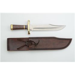 Custom clip point knife and leather sheath  signed Dan H. Hanson in like new condition,  approx. 13”