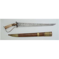 Southeast Asian sword with engraved blade and  bone grip, approx. 32” overall and a 24”  blade, in v