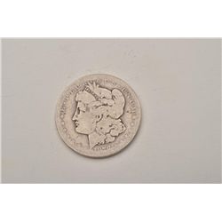 Lot of 2 coins, one a well-worn Morgan silver  dollar, 1878-CC rare date and the other, a  Walking L