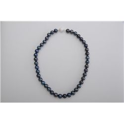 One strand of black pearls 9.5 mm diameter  with a frosted round silver clasp.  Est.:$350-$500.