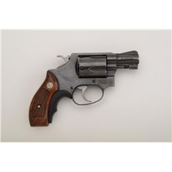 Smith & Wesson Model 36 DA revolver, .38  Special cal., 2” barrel, blue finish,  checkered wood meda