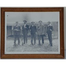 Copy of an antique photograph identified Aug.  1906 in left corner showing 5 shooters with  shotguns
