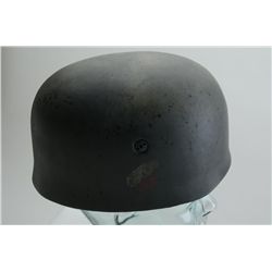 Well-done copy of a German WW II nazi  paratrooper helmet with liner and chin strap;  overall good c