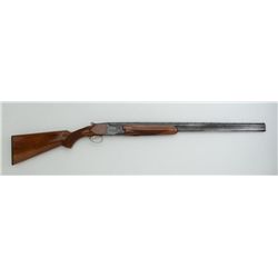 Charles Daly by Miroku O/U hammerless  shotgun, 20 gauge, 28” barrels, blue finish,  checkered wood