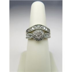 Intricate 14 karat white gold ladies ring set  with over 86 round and baguette cut diamonds  weighin