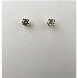 Brilliant 14 karat yellow gold ladies  earrings set with two round brilliant cut  diamonds weighing 