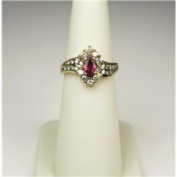 Elegant 14 karat yellow gold ladies by pass  design ring set with a MQ cut ruby weighing  approx. 0.