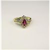 Image 3 : Elegant 14 karat yellow gold ladies by pass  design ring set with a MQ cut ruby weighing  approx. 0.