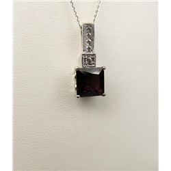 Exquisite 14 karat white gold ladies pendant  set with a center princess cut Rhodolite  garnet weigh