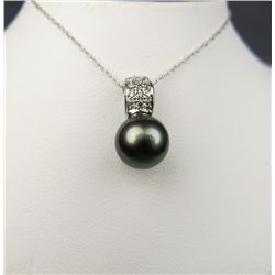 Elegant 14 karat white gold ladies pendant  set with a round black pearl averaging 10.00  mm in diam