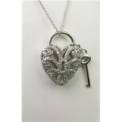 Intricate ladies Sterling silver key design  necklace pave set with over 50 rounds.  Estimate $300-$