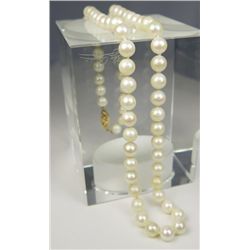 Nice ladies 18 inch strand of round cultured  pearls averaging 6.50 MM in diameter on a 14  karat ye