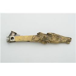 Fancy bronze cigar cutter in shape of horse  head, approx. 6” overall with rich patina.   Est.:  $20