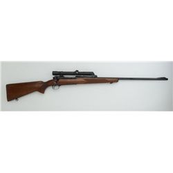 Winchester Model 70 bolt action rifle, .300  Magnum cal., 26” barrel, blue finish,  checkered wood s