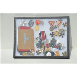 Large riker case of mostly German military  medals and ribbons, including iron crosses  and a number