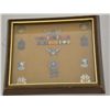 Image 1 : Framed shadow box of pins and badges of 1st  Sgt. Dale Brown’s Vietnam service with the  228th Aviat