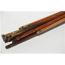 Lot of antique shotgun cleaning rods,  memorabilia, loading tools, shells, etc.   Est.:  $150-$300.