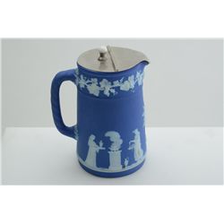 Wedgewood pitcher with metal cover, approx.  5-1/2” tall and in very good condition.   Est.:  $100-$