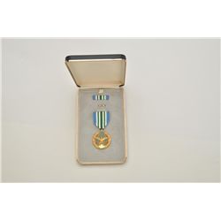 U.S.A.F. medal and ribbons for military merit  with case; per consignor, reported to belong  to Col.