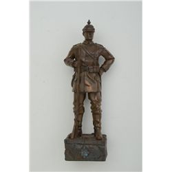 Small metal statue of a WW I German soldier  in uniform, approx. 11” in height.  Est.:   $50-$100.