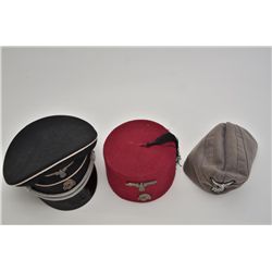 Lot of 3 reproduction German nazi military  hats.  Est.:  $50-$75.