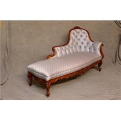 A Victorian Mahogany Framed Chaise Longue with Foliate Carving, Button Back on...
